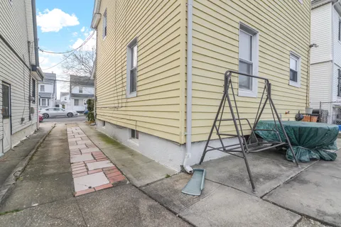 a view of a backyard with sitting area