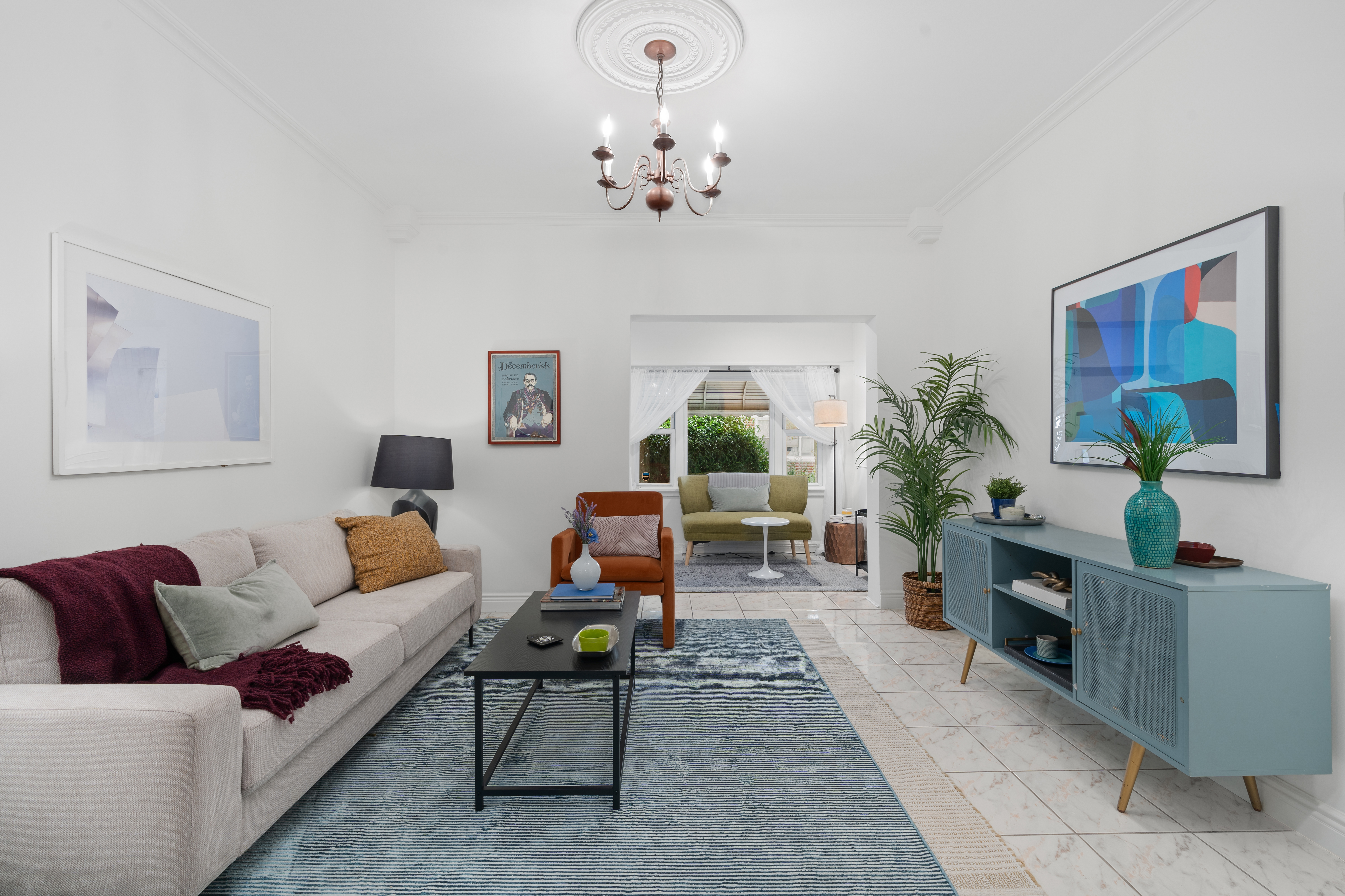 138 East 29th Street Brooklyn, NY 11226 - Photo 2 of 12 a living room with furniture a chandelier and a window