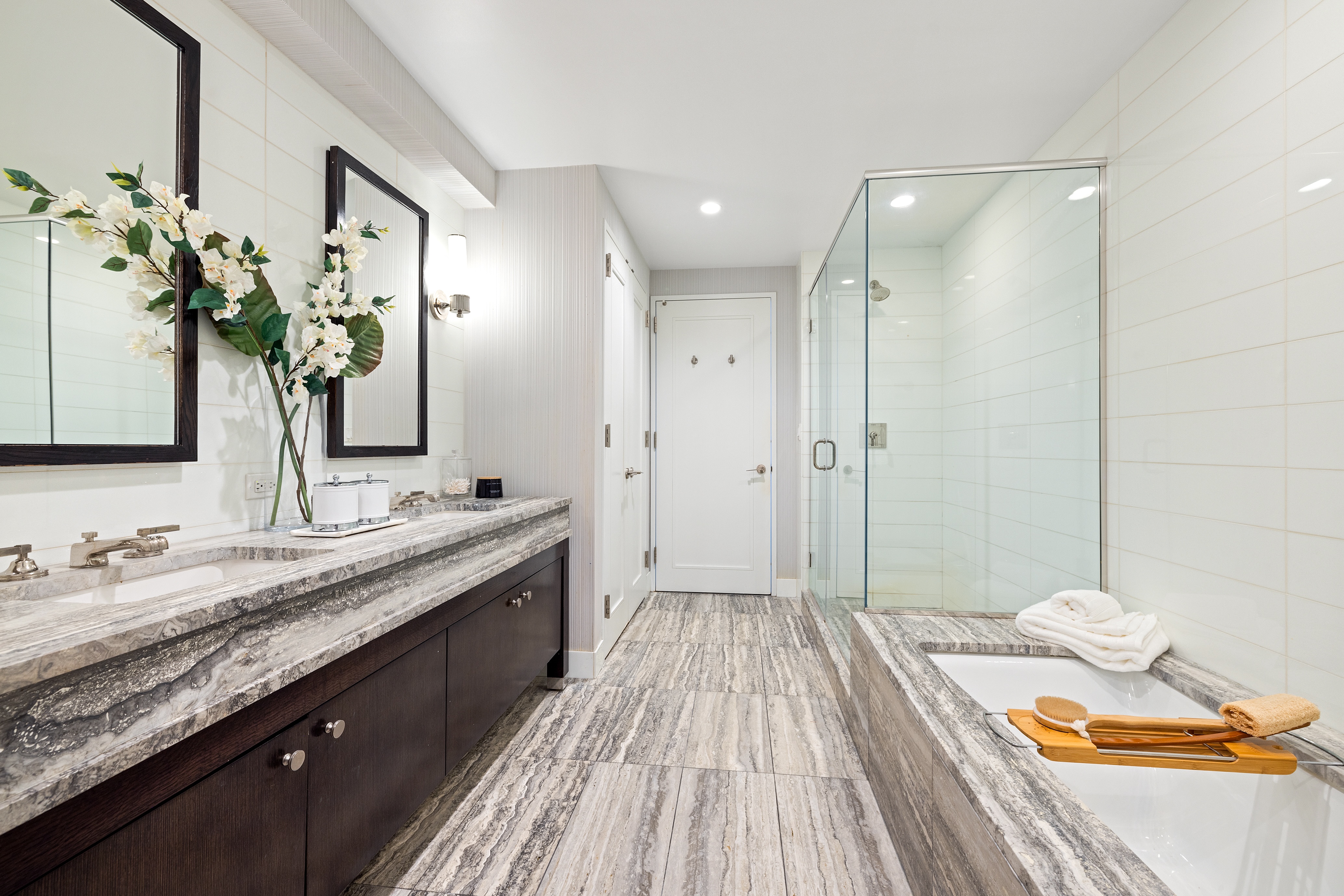 80 Riverside Boulevard, Unit 6B/L Manhattan, NY 10069 - Photo 8 of 17 a spacious bathroom with a granite countertop sink a mirror and a shower
