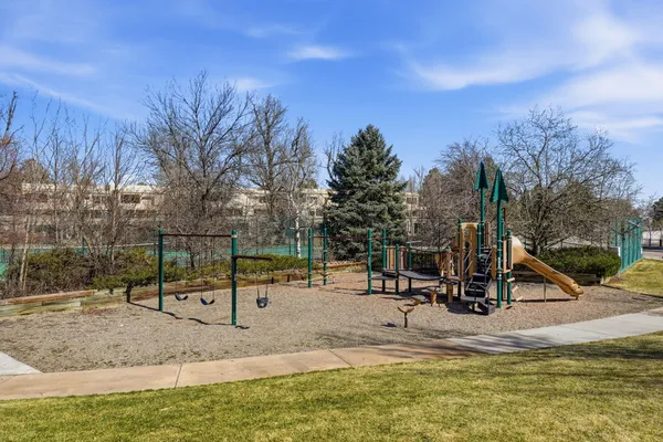 a view of a swimming pool with a yard