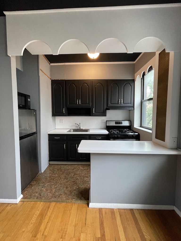 266 West 22nd Street, Unit 2 Manhattan, NY 10011 - Photo 2 of 14 a kitchen with stainless steel appliances granite countertop a sink stove and refrigerator
