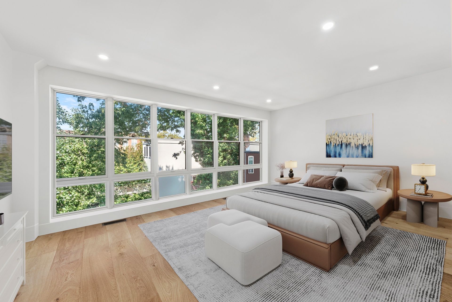 65 Bainbridge Street Brooklyn, NY 11233 - Photo 12 of 24 a bedroom with a large bed and a large window