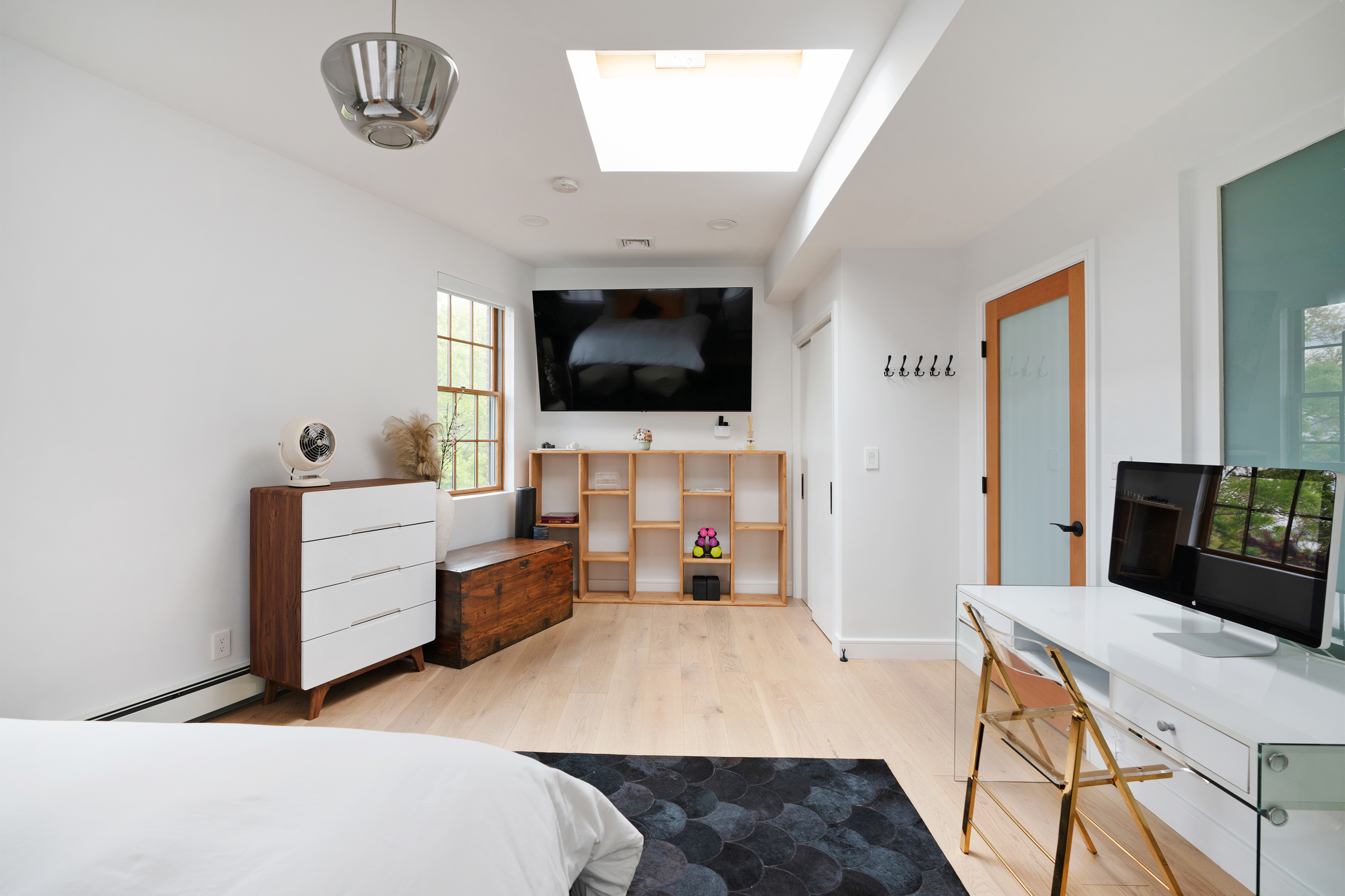 334 Plymouth Street Brooklyn, NY 11201 - Photo 15 of 32 a bedroom with furniture and a flat screen tv