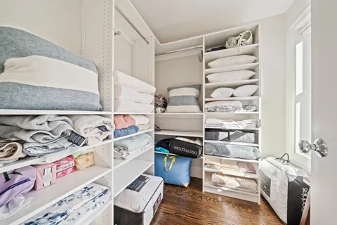 an aerial view of a residential houses with yard