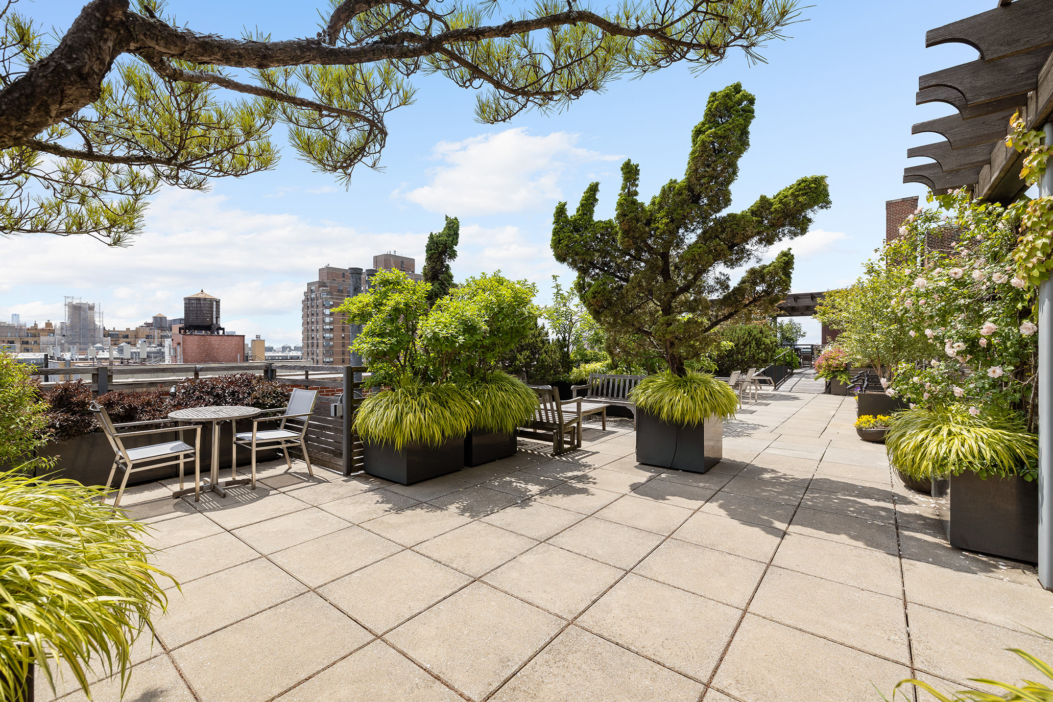 201 West 89th Street, Unit 1E Manhattan, NY 10024 - Photo 8 of 12 a view of a terrace with chairs and potted plants