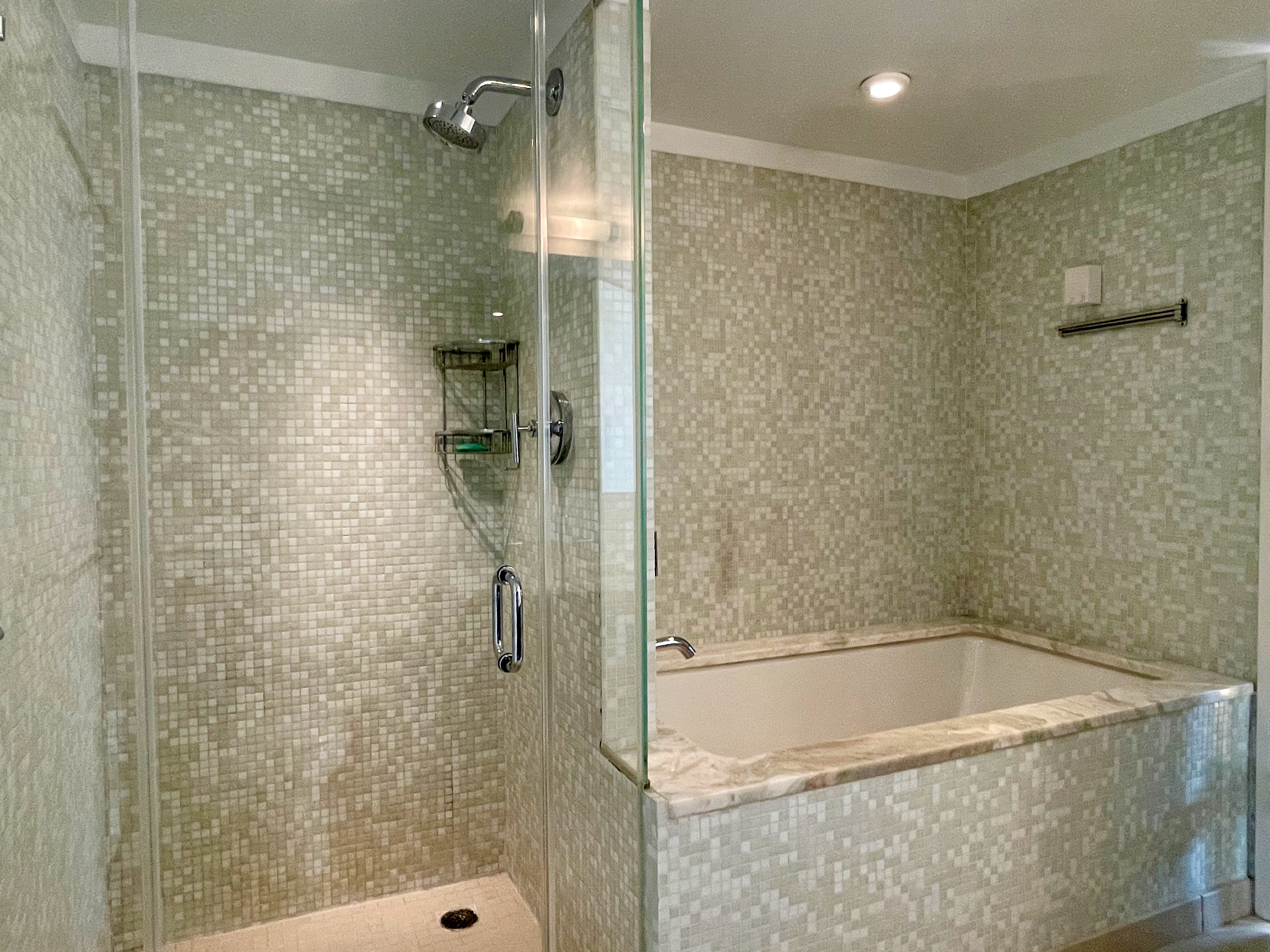 350 West 53rd Street, Unit PHA Manhattan, NY 10019 - Photo 16 of 35 a bathroom with a bathtub and shower