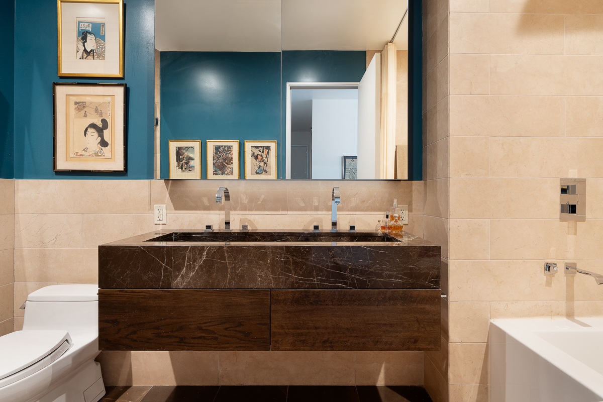 140 West 22nd Street, Unit PHC Manhattan, NY 10011 - Photo 7 of 15 a bathroom with a sink and a mirror
