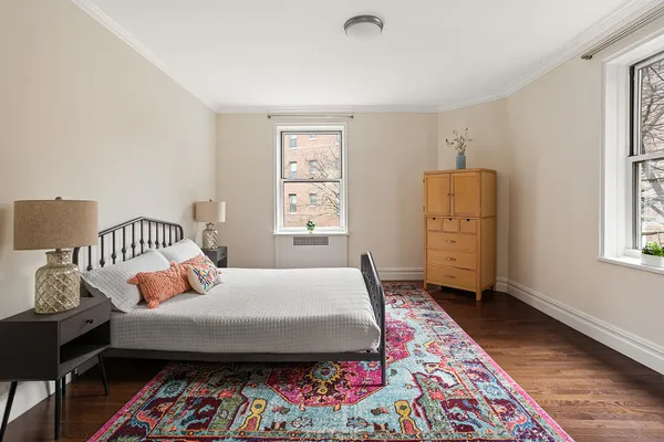 a bed room with a bed and a window