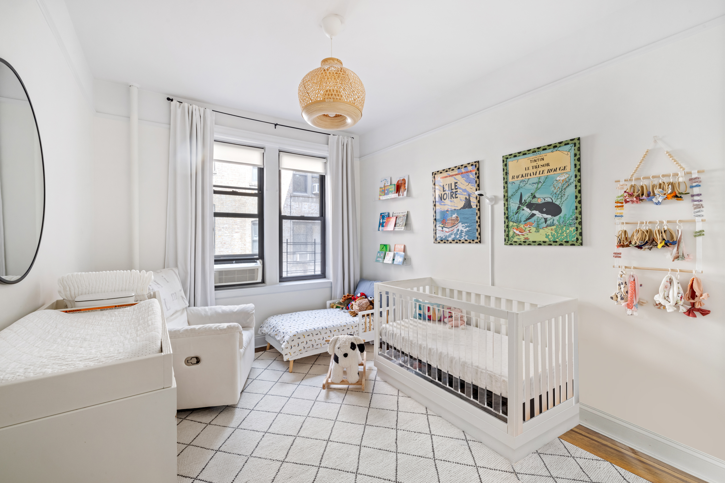 305 East 88th Street, Unit 4A Manhattan, NY 10128 - Photo 7 of 13 a bedroom with furniture and a large window