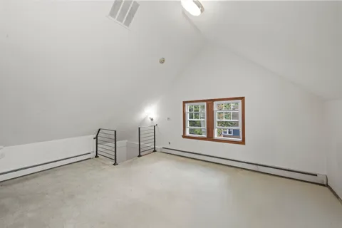 an empty room with a empty space and window