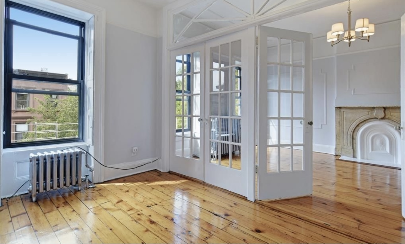 195 Adelphi Street, Unit 3 Brooklyn, NY 11205 - Photo 2 of 7 a view of a livingroom with wooden floor and furniture