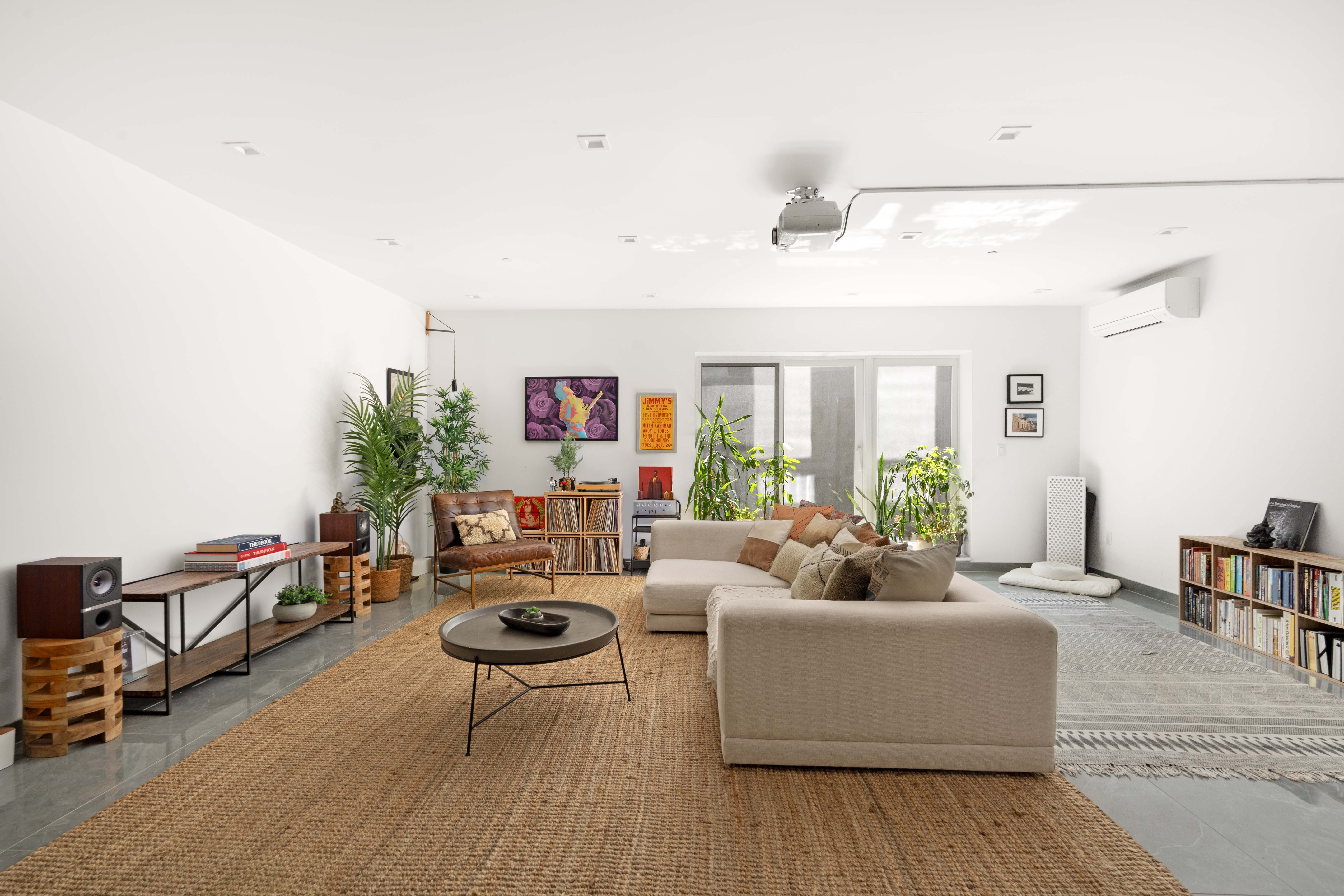 676 Halsey Street, Unit 1B Brooklyn, NY 11233 - Photo 6 of 9 a living room with furniture and a wooden floor