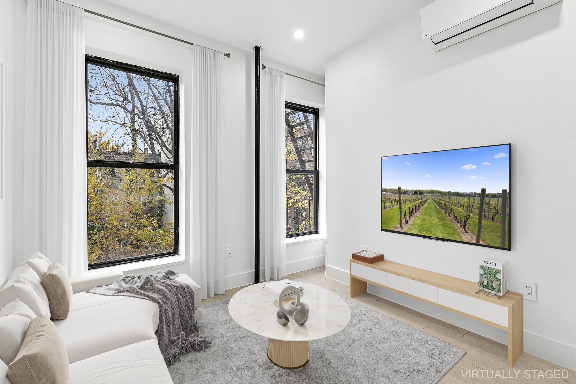 a living room with furniture and a flat screen tv
