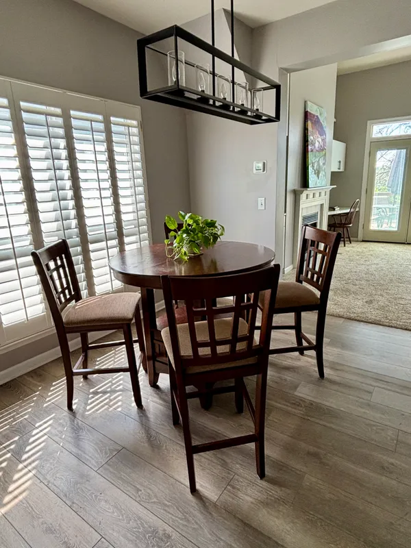 a dining room with furniture and window