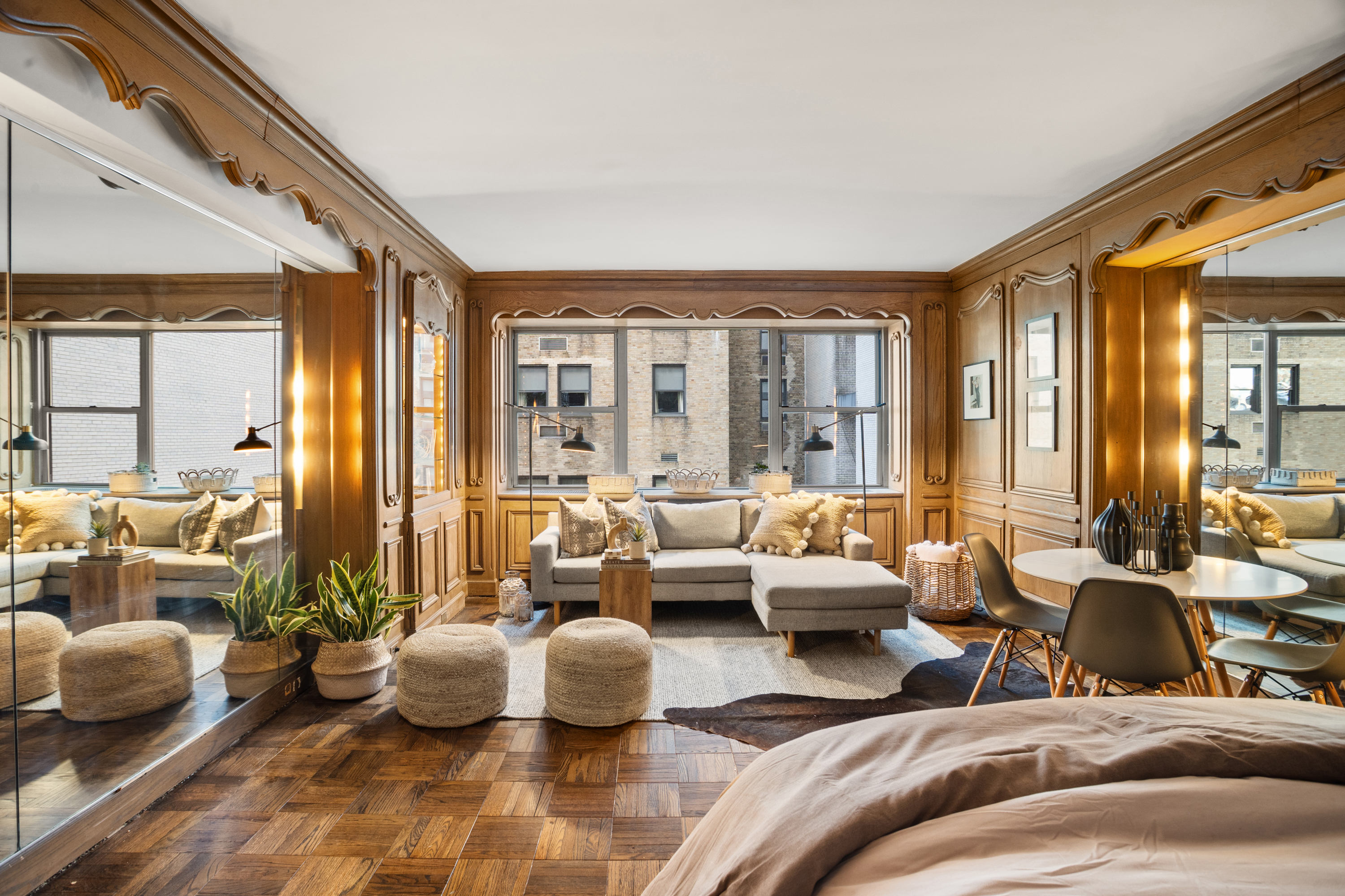 110 East 57th Street, Unit 16B Manhattan, NY 10022 - Photo 4 of 15 a living room with furniture and a large window