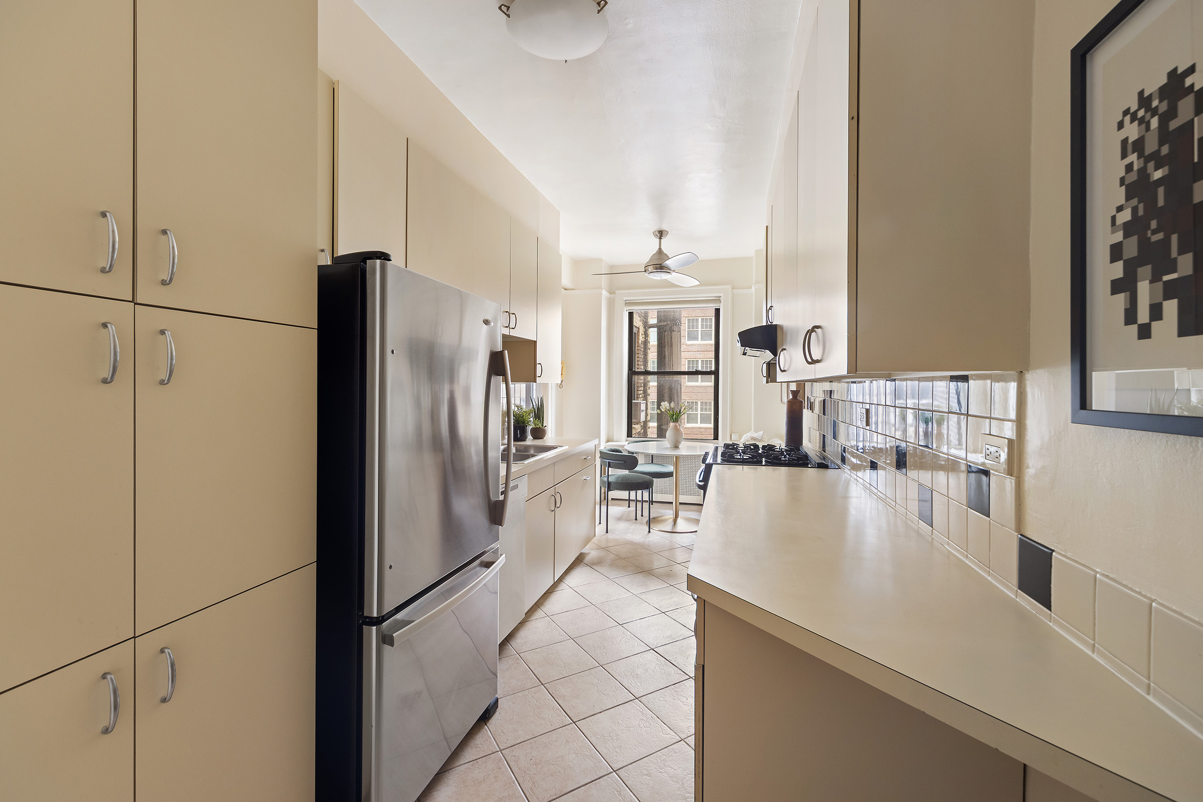 710 West End Avenue, Unit 9A Manhattan, NY 10025 - Photo 3 of 8 a kitchen with stainless steel appliances granite countertop a refrigerator a stove and a sink with cabinets