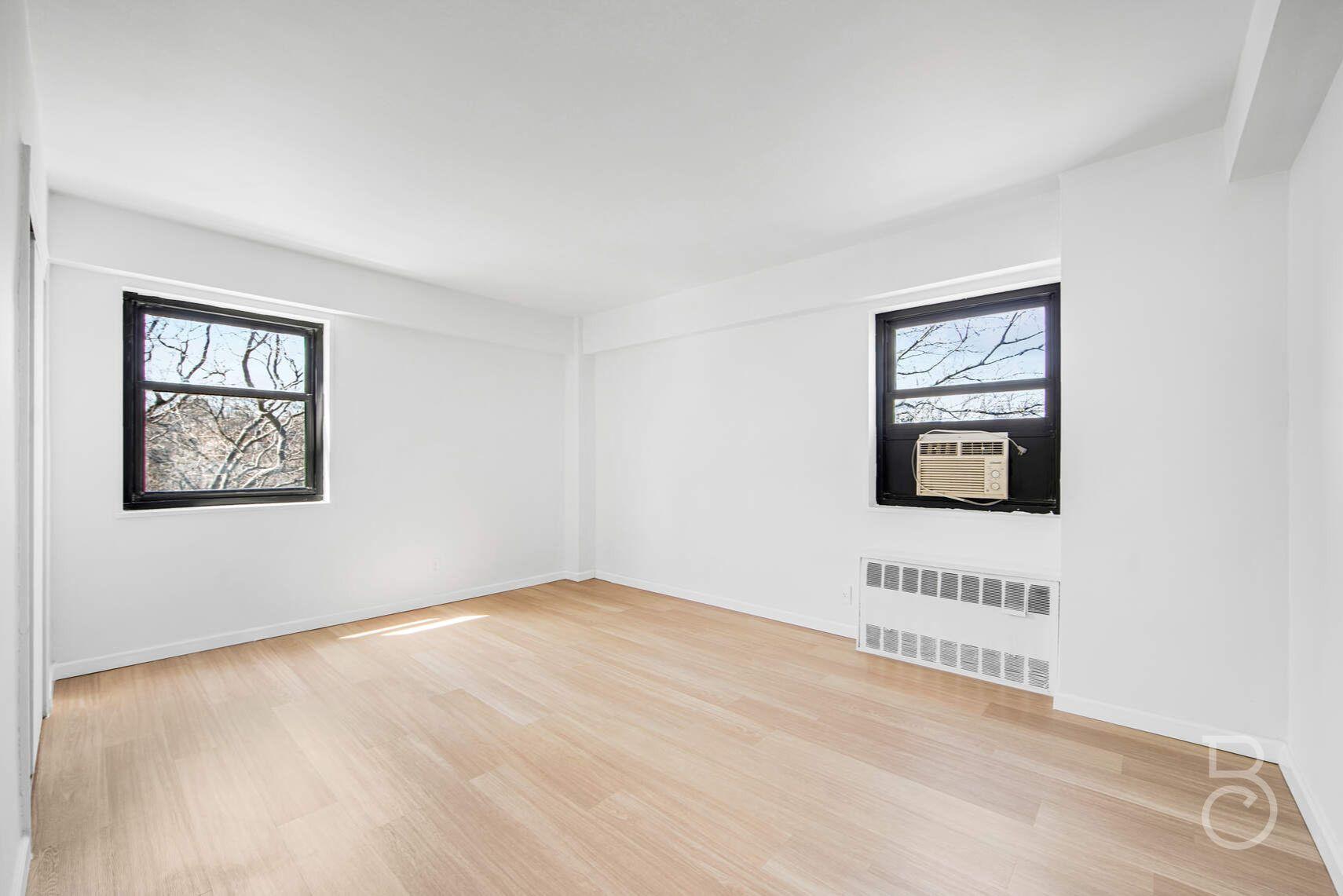 33-65 14th Street, Unit 5D Queens, NY 11106 - Photo 9 of 11 an empty room with a window