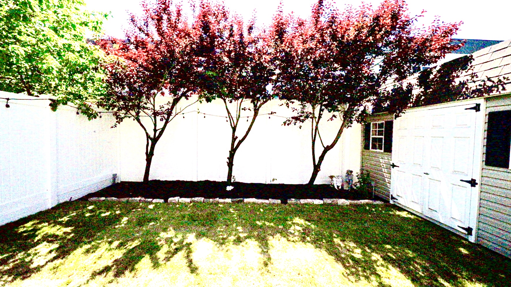 1-69 Beach 98th Street, Unit 1 Queens, NY 11694 - Photo 20 of 23 a backyard of a house with lots of green space