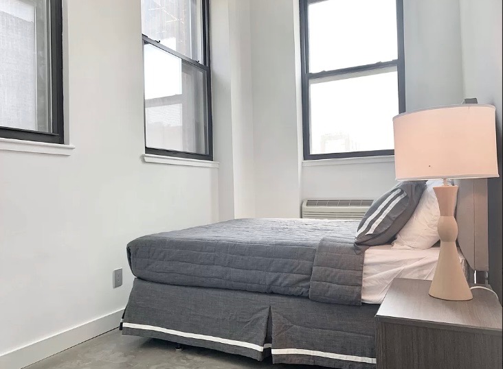 44 Berry Street, Unit 2C Brooklyn, NY 11249 - Photo 4 of 8 a bedroom with a bed and window