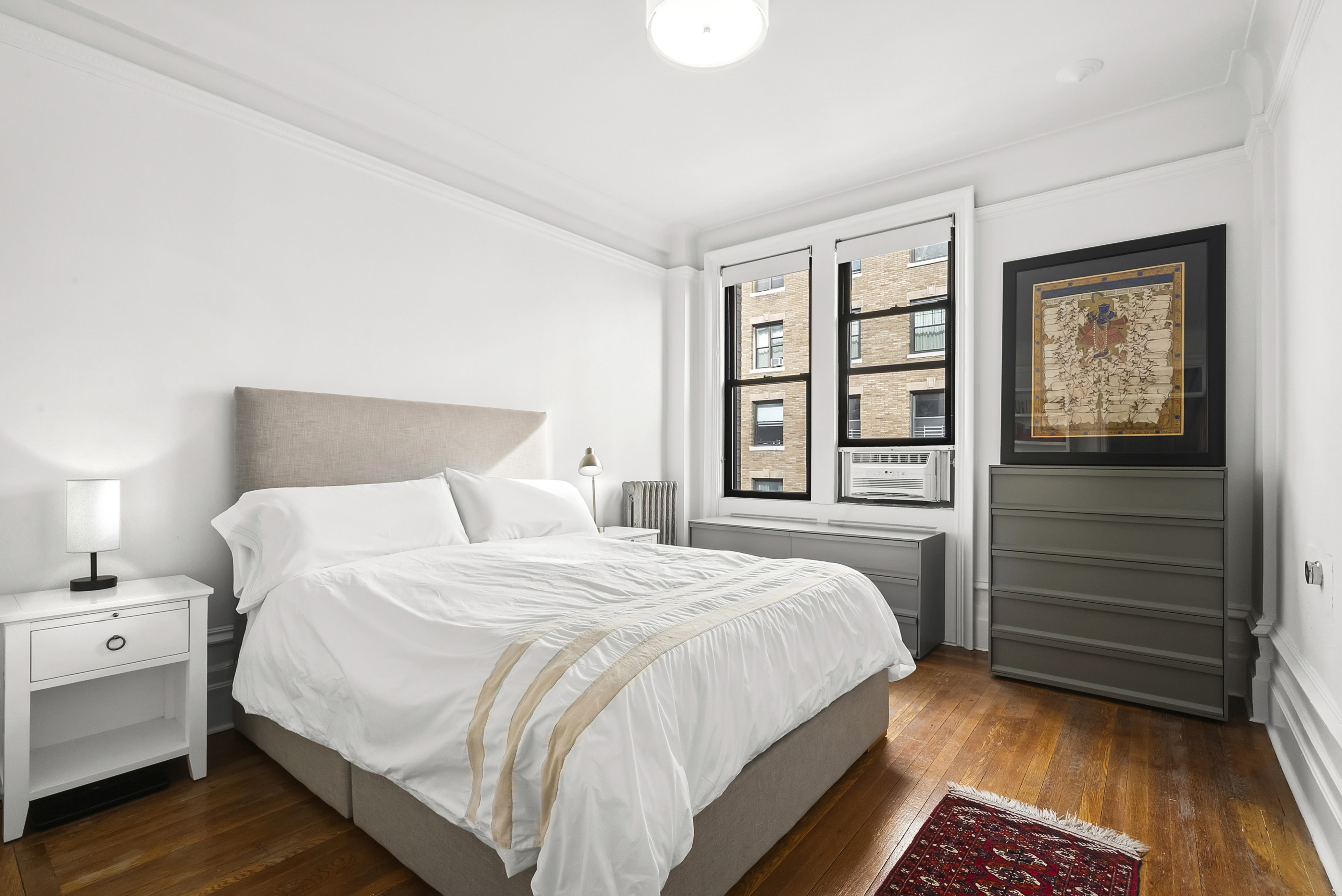 536 West 111th Street, Unit 66 Manhattan, NY 10025 - Photo 4 of 8 a bedroom with a bed and a window