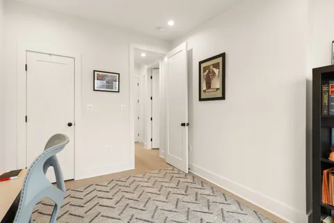 a view of a hallway with front door