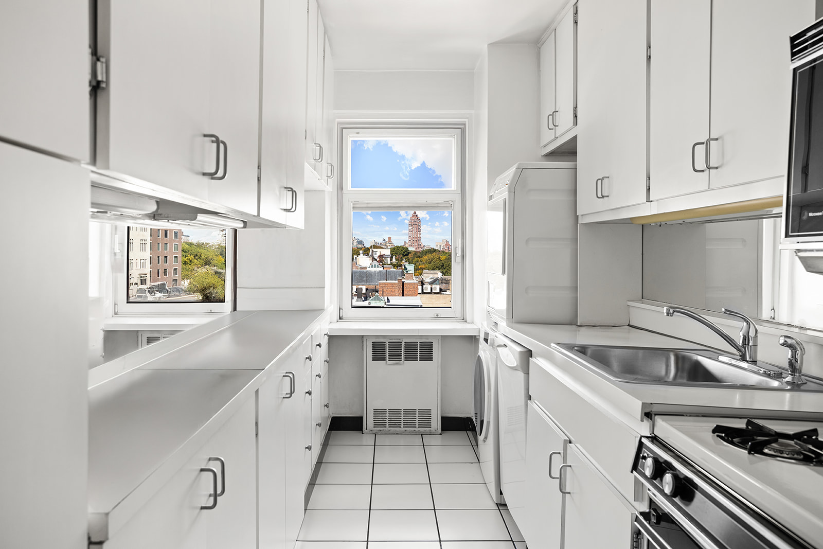 50 East 79th Street, Unit 12B Manhattan, NY 10075 - Photo 7 of 13 a kitchen that has a sink and a stove