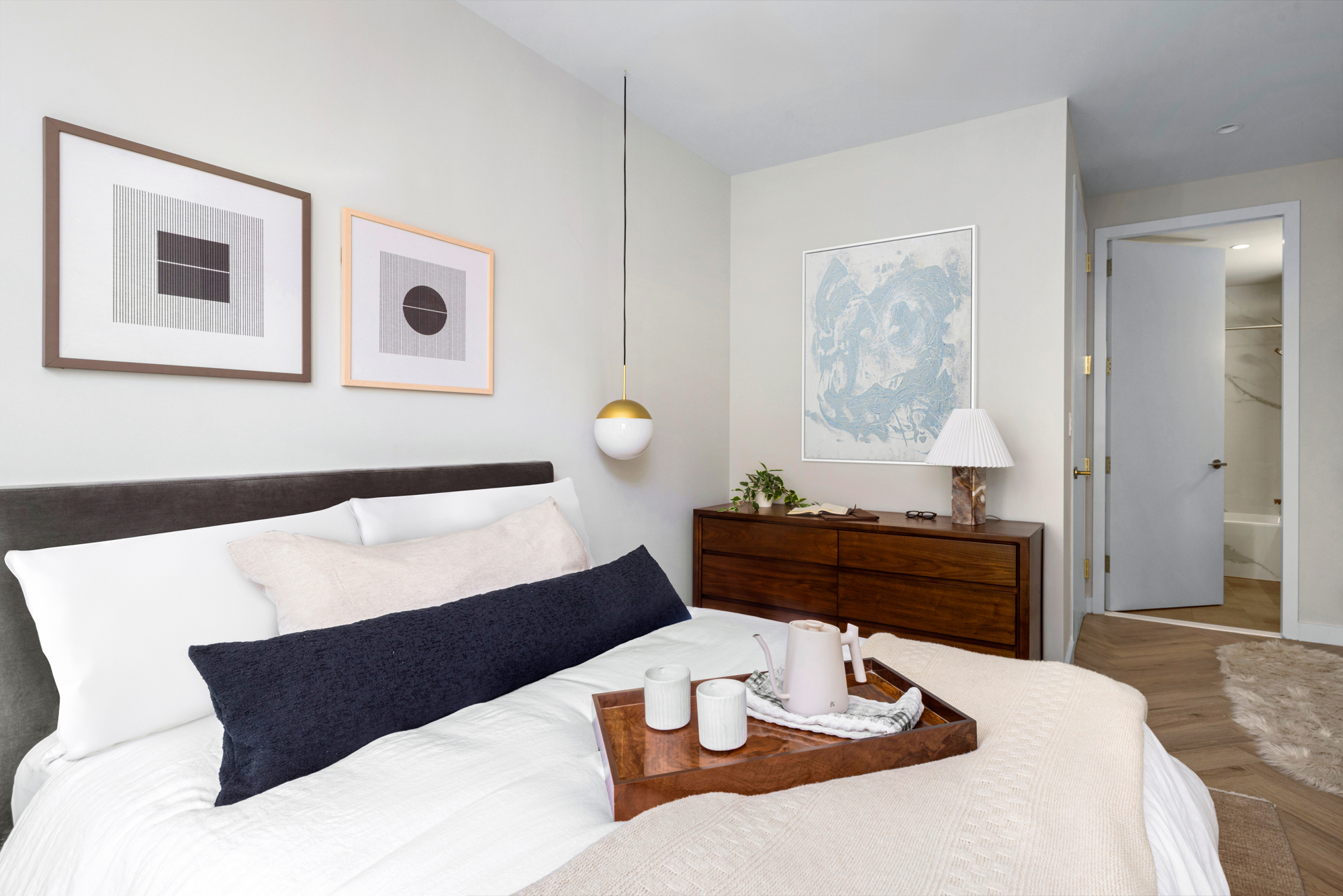 980 6th Avenue, Unit 416 Manhattan, NY 10018 - Photo 4 of 22 a bed room with a bed and a table