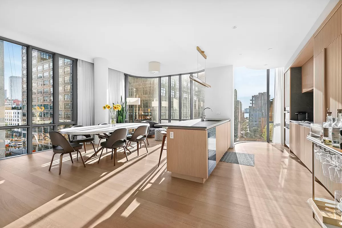 565 Broome Street, Unit S8C Manhattan, NY 10013 - Photo 7 of 24 a living room with furniture and a large window