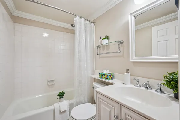 a bathroom with a sink toilet and tub