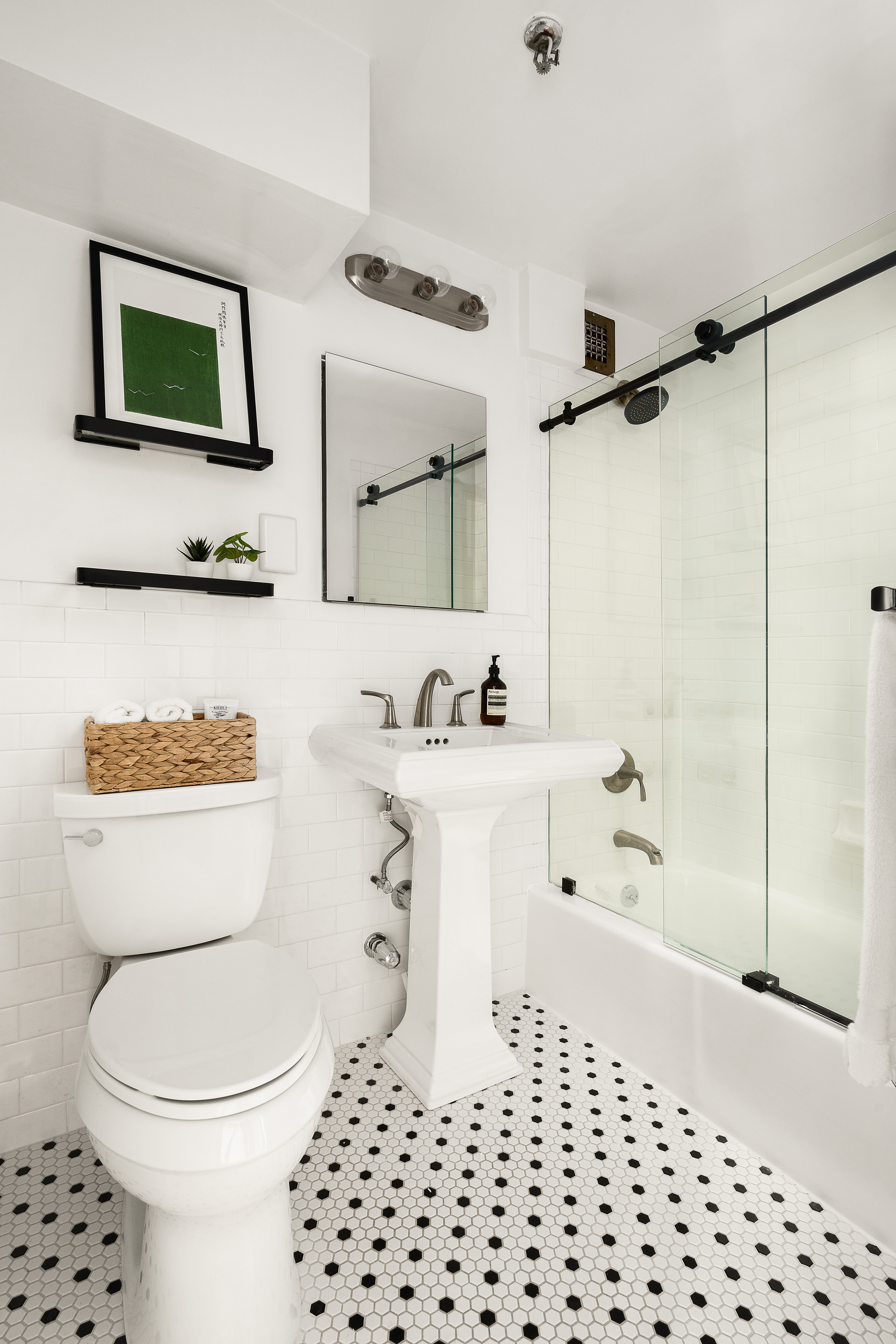 67 East 11th Street, Unit 624 Manhattan, NY 10003 - Photo 6 of 13 a bathroom with a sink a toilet and shower