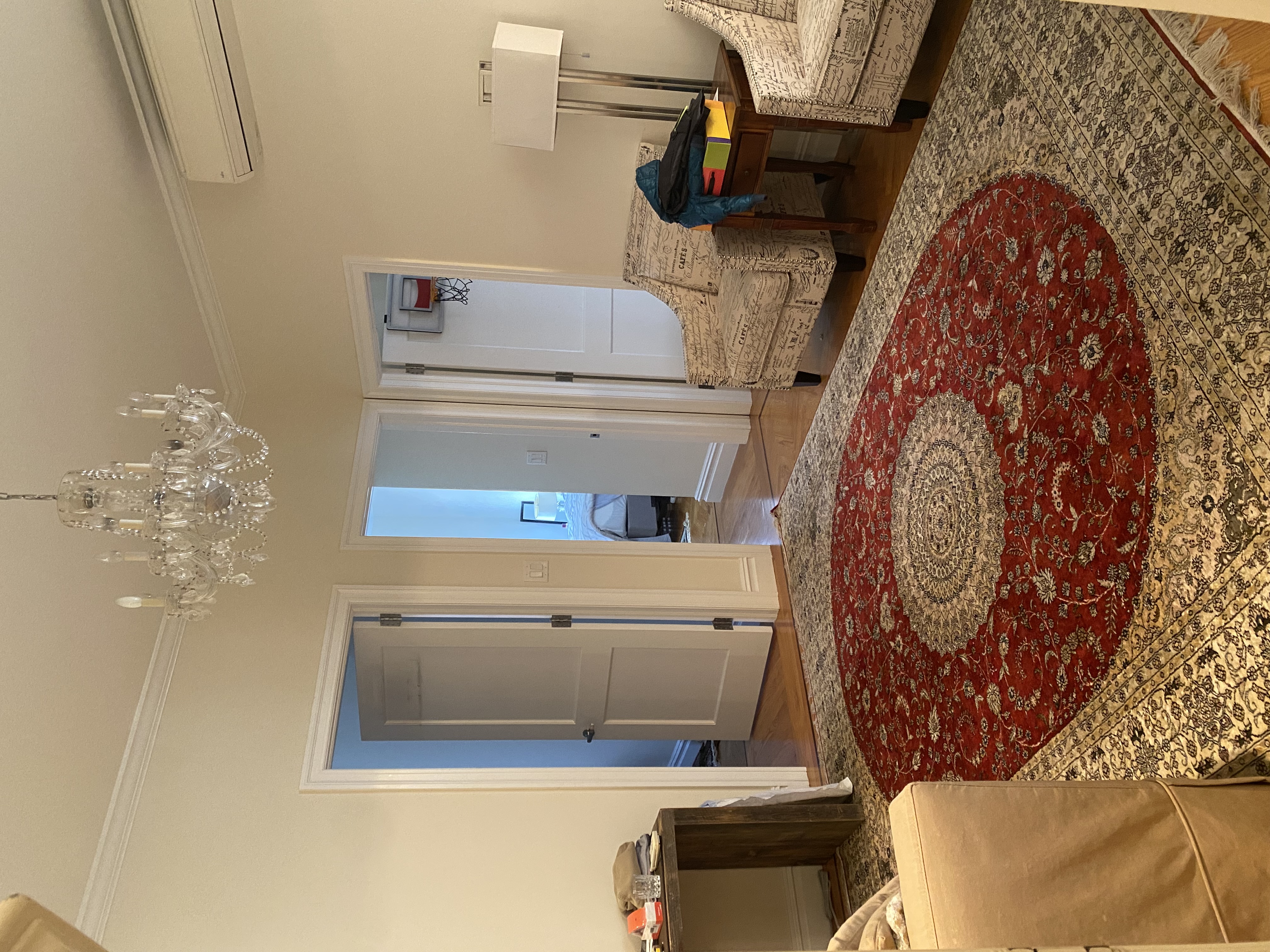 1240 Park Avenue, Unit 6B Manhattan, NY 10128 - Photo 3 of 13 a living room with furniture rug and a chandelier