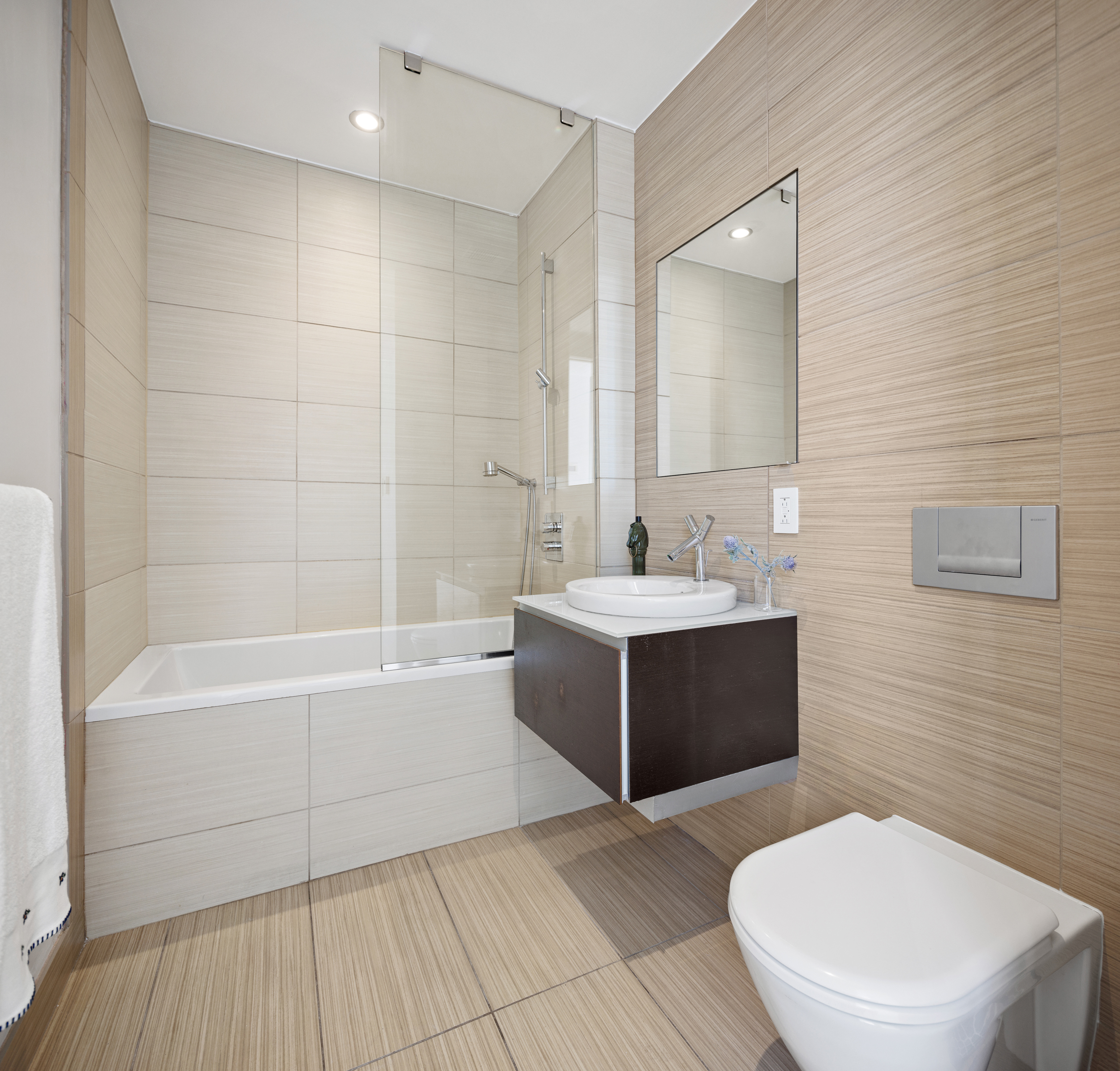 166 West 18th Street, Unit PH11 Manhattan, NY 10011 - Photo 14 of 16 a bathroom with a sink a toilet and bathtub