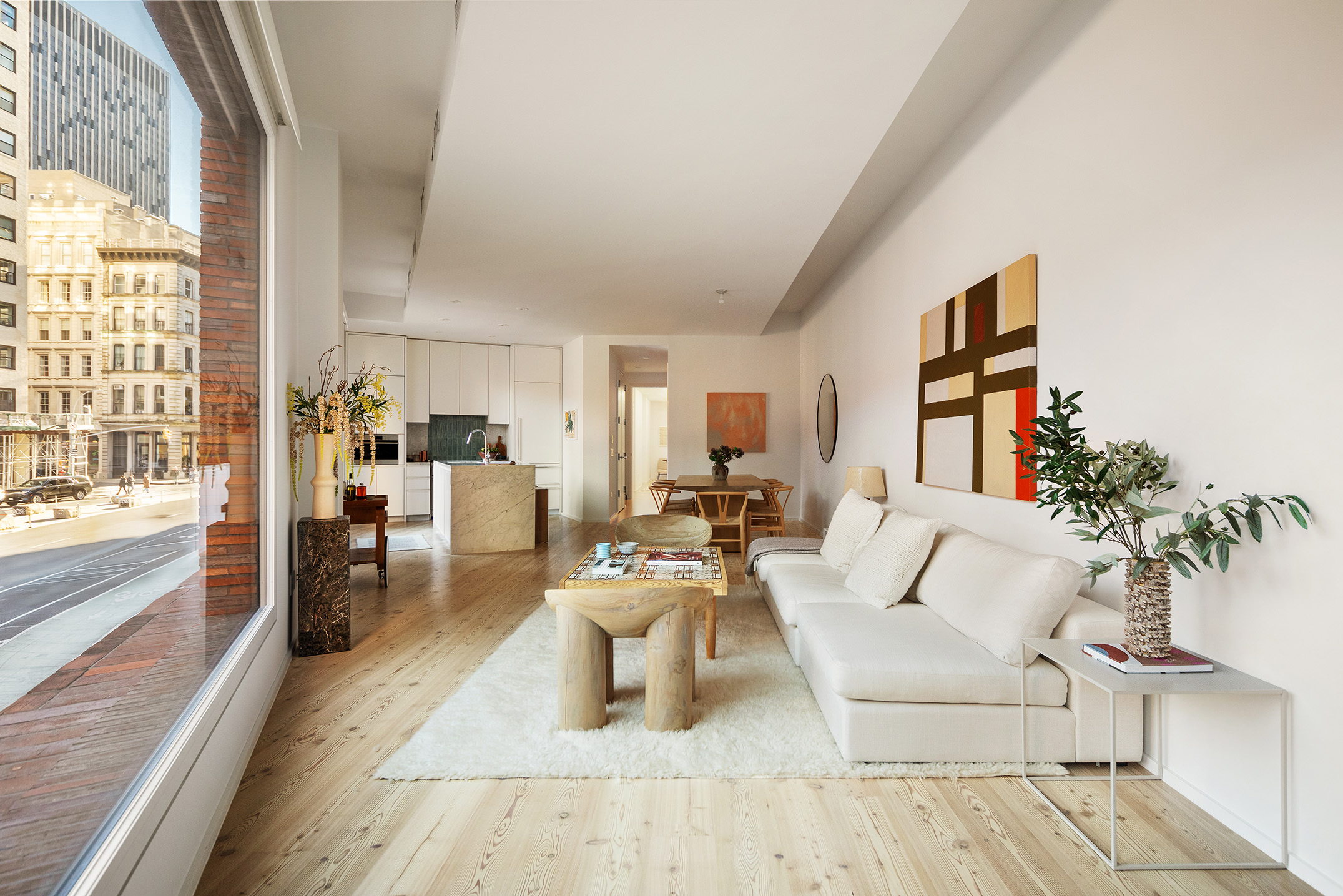 1 Avenue Of The Americas, Unit 2N Manhattan, NY 10013 - Photo 2 of 15 a living room with furniture and a large window