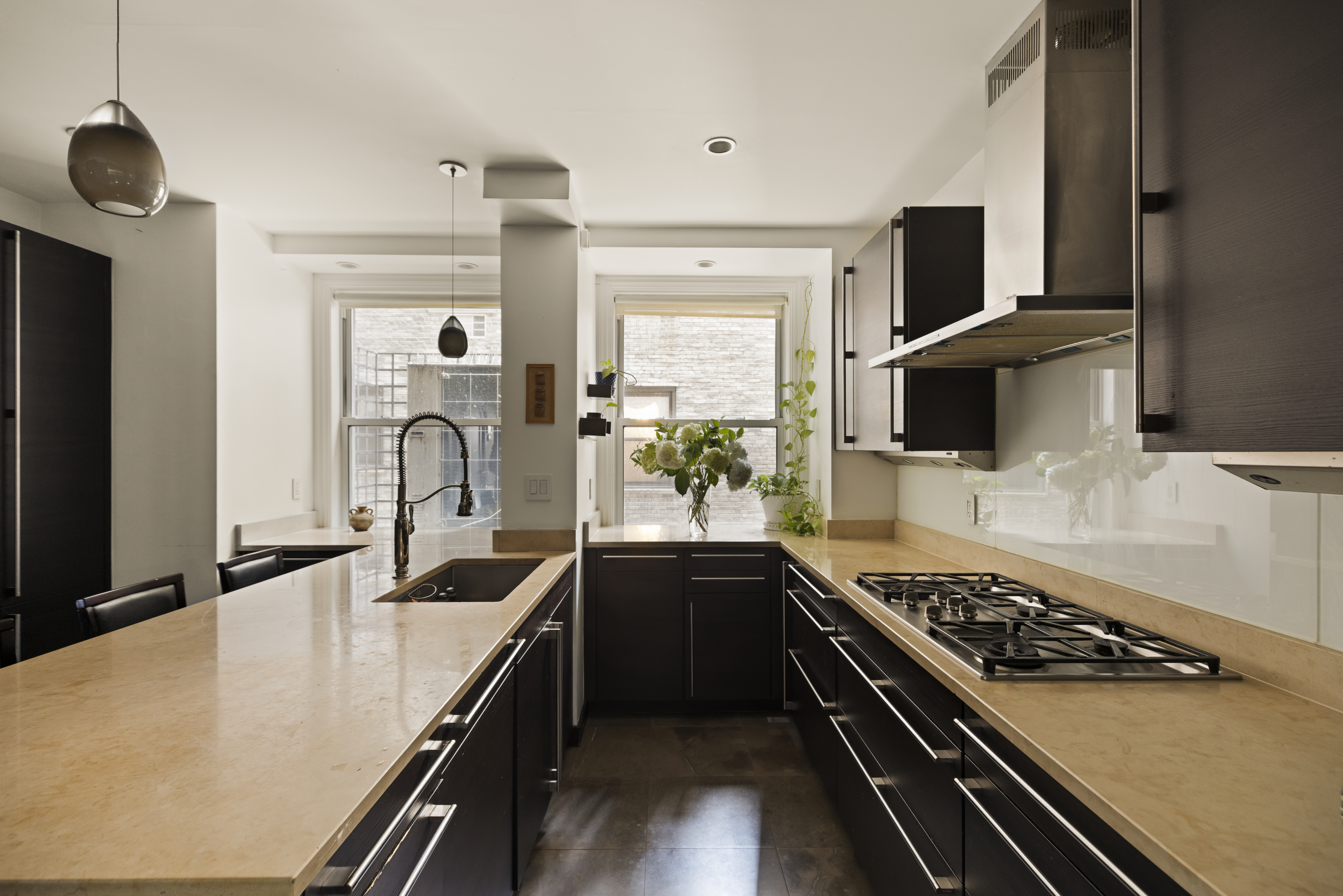 1158 5th Avenue, Unit 4A Manhattan, NY 10128 - Photo 3 of 23 a kitchen with stainless steel appliances a sink dishwasher stove refrigerator and microwave