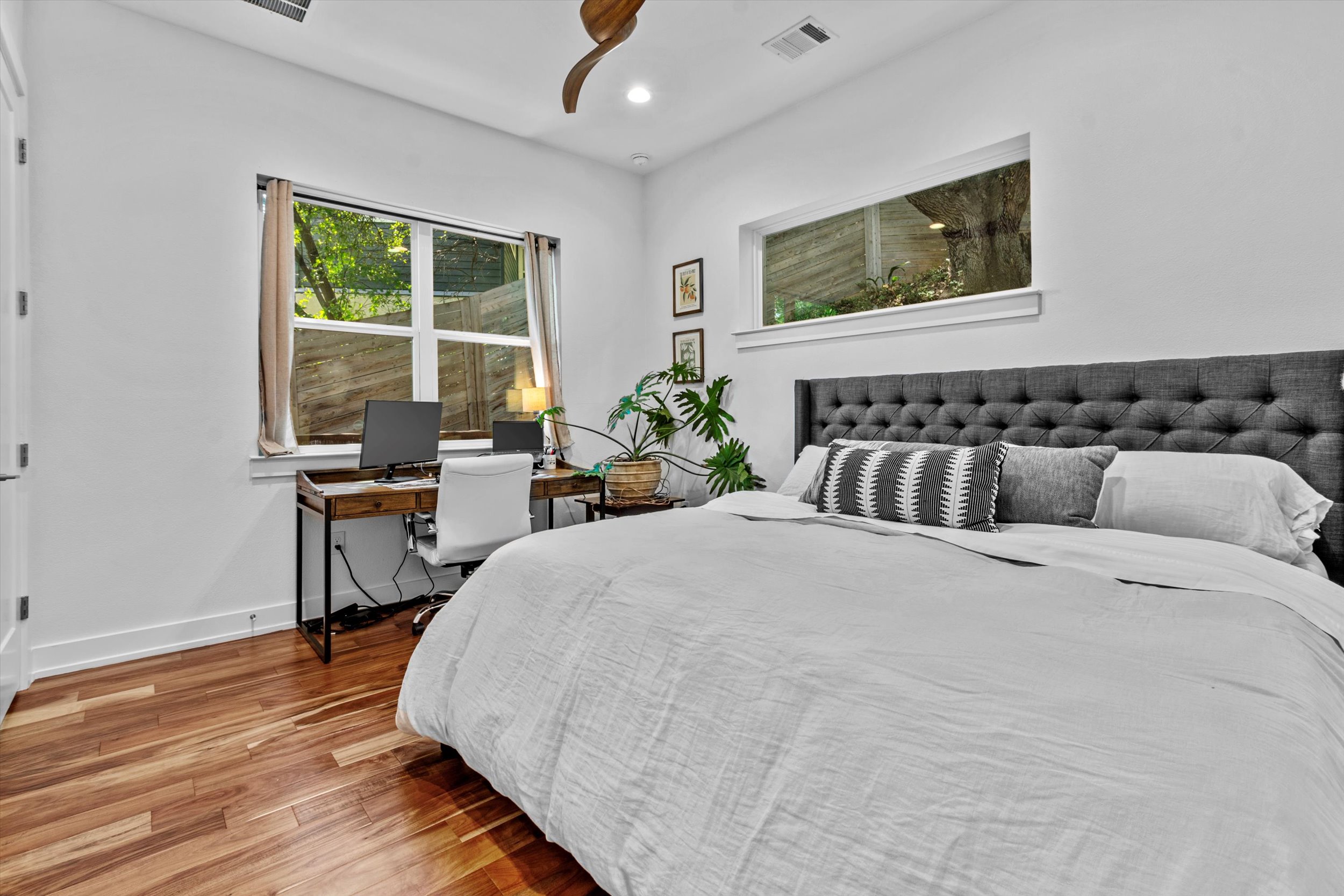 2712 Oak Springs Drive, Unit A Austin, TX 78702 - Photo 13 of 38 a bedroom with a bed and a table