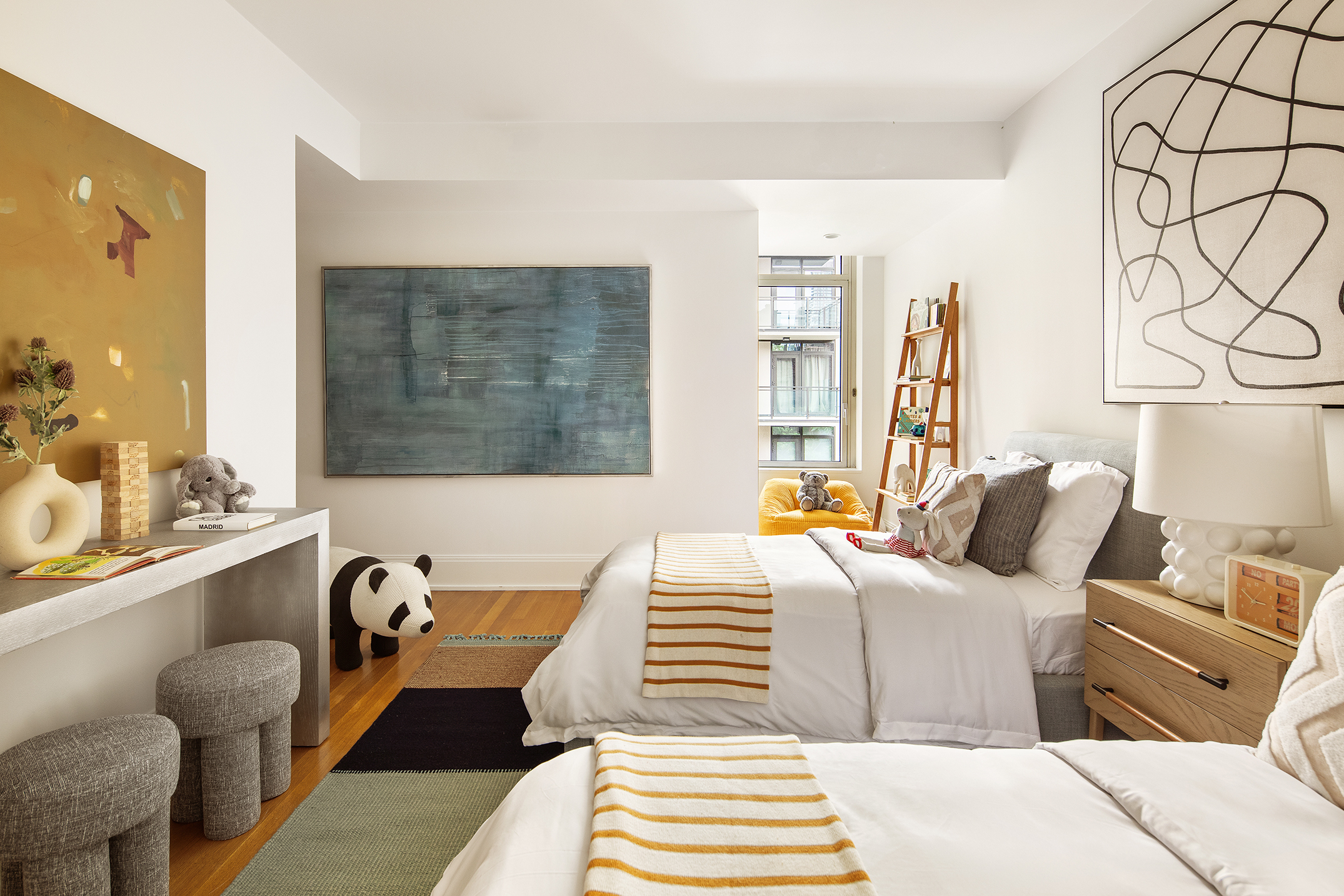 305 East 85th Street, Unit 5B Manhattan, NY 10028 - Photo 9 of 11 a bedroom with a bed and wooden floor