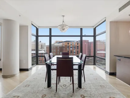 a view of a dining room with furniture window and outside view