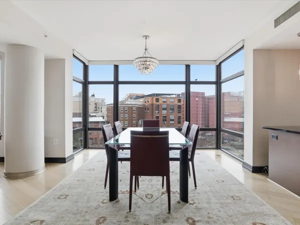 a view of a dining room with furniture window and outside view