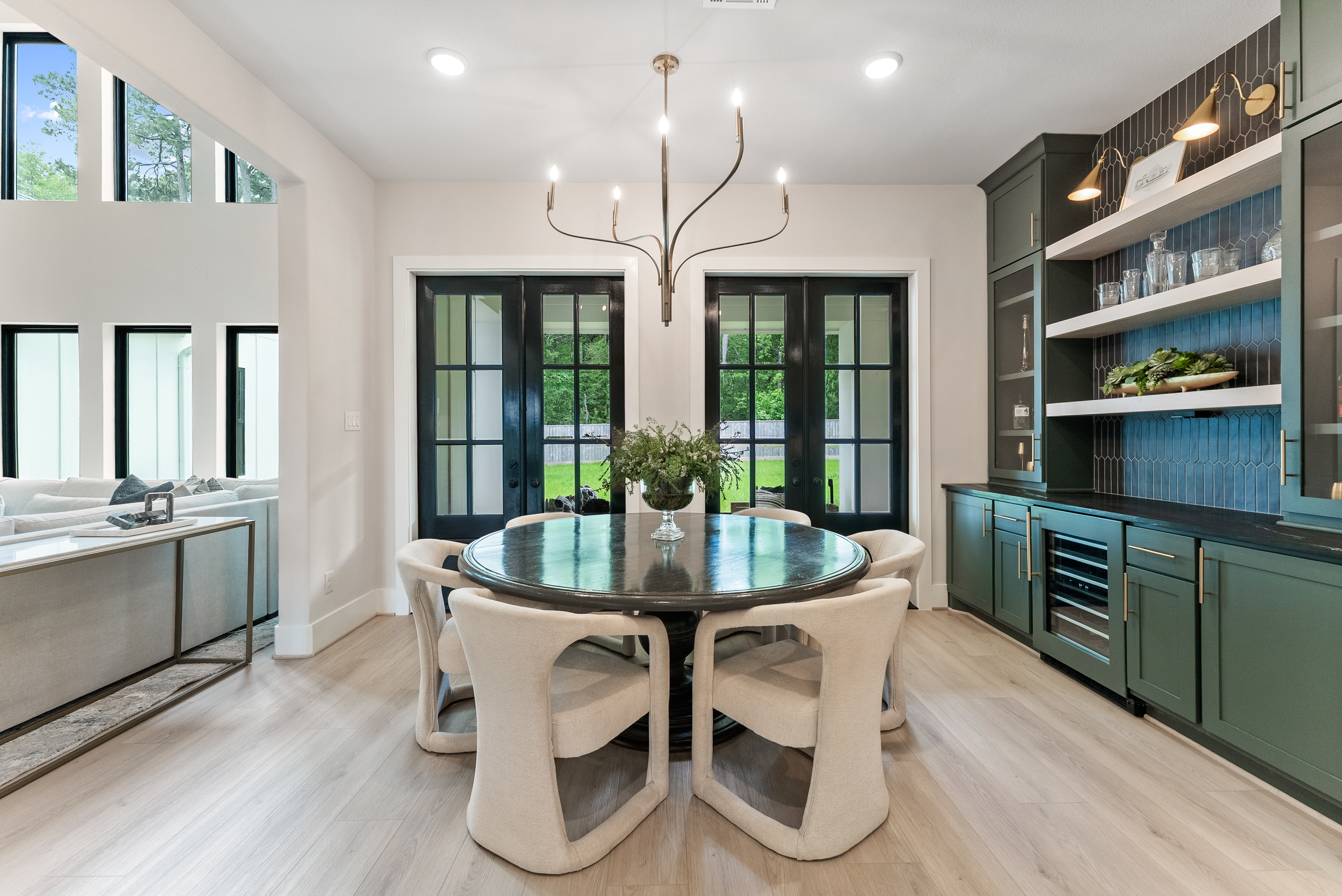 2118 Bennet Court Conroe, TX 77384 - Photo 21 of 70 a dining room with furniture a chandelier and wooden floor