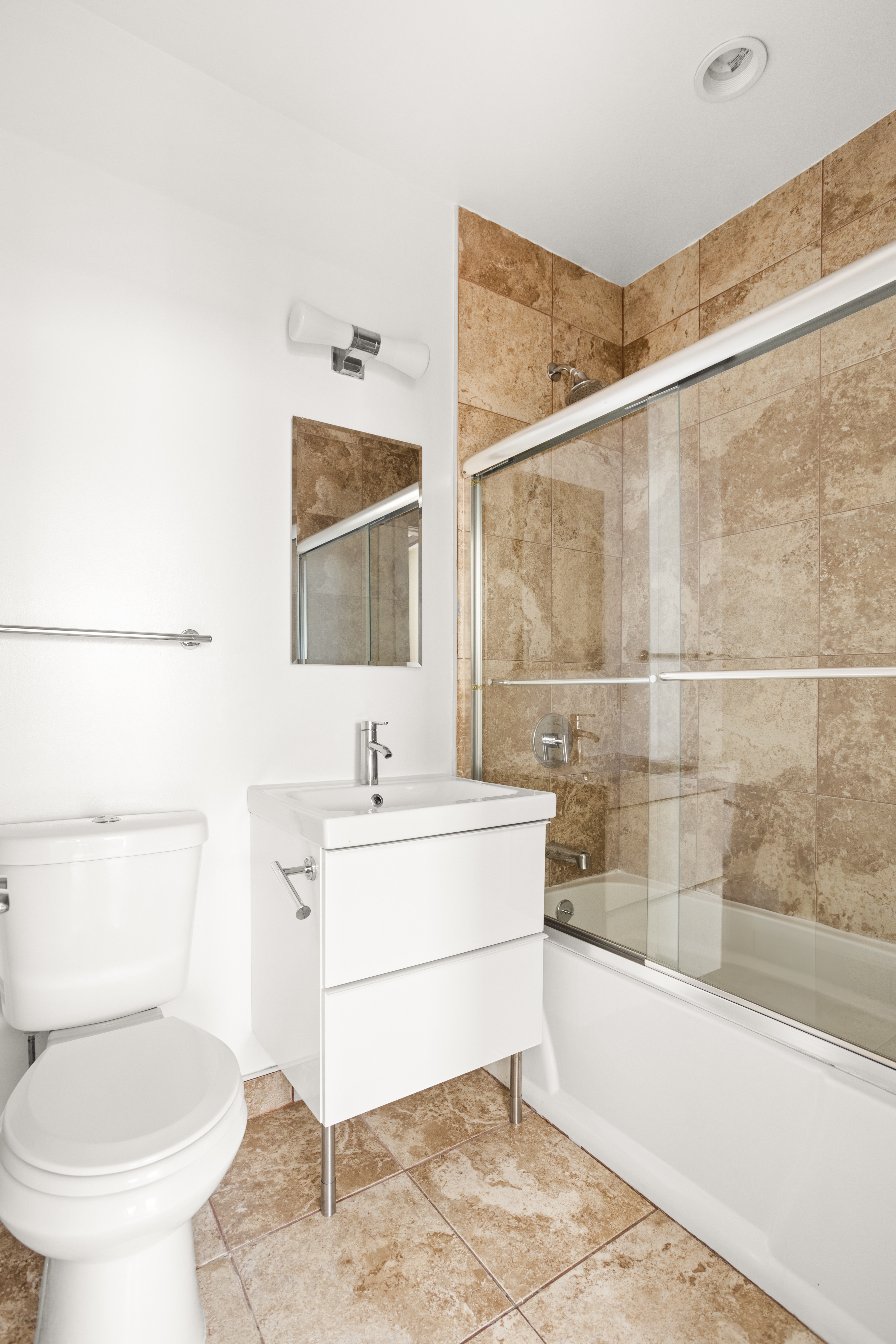 22 East 13th Street, Unit 2R Manhattan, NY 10003 - Photo 6 of 8 a bathroom with a sink toilet and tub
