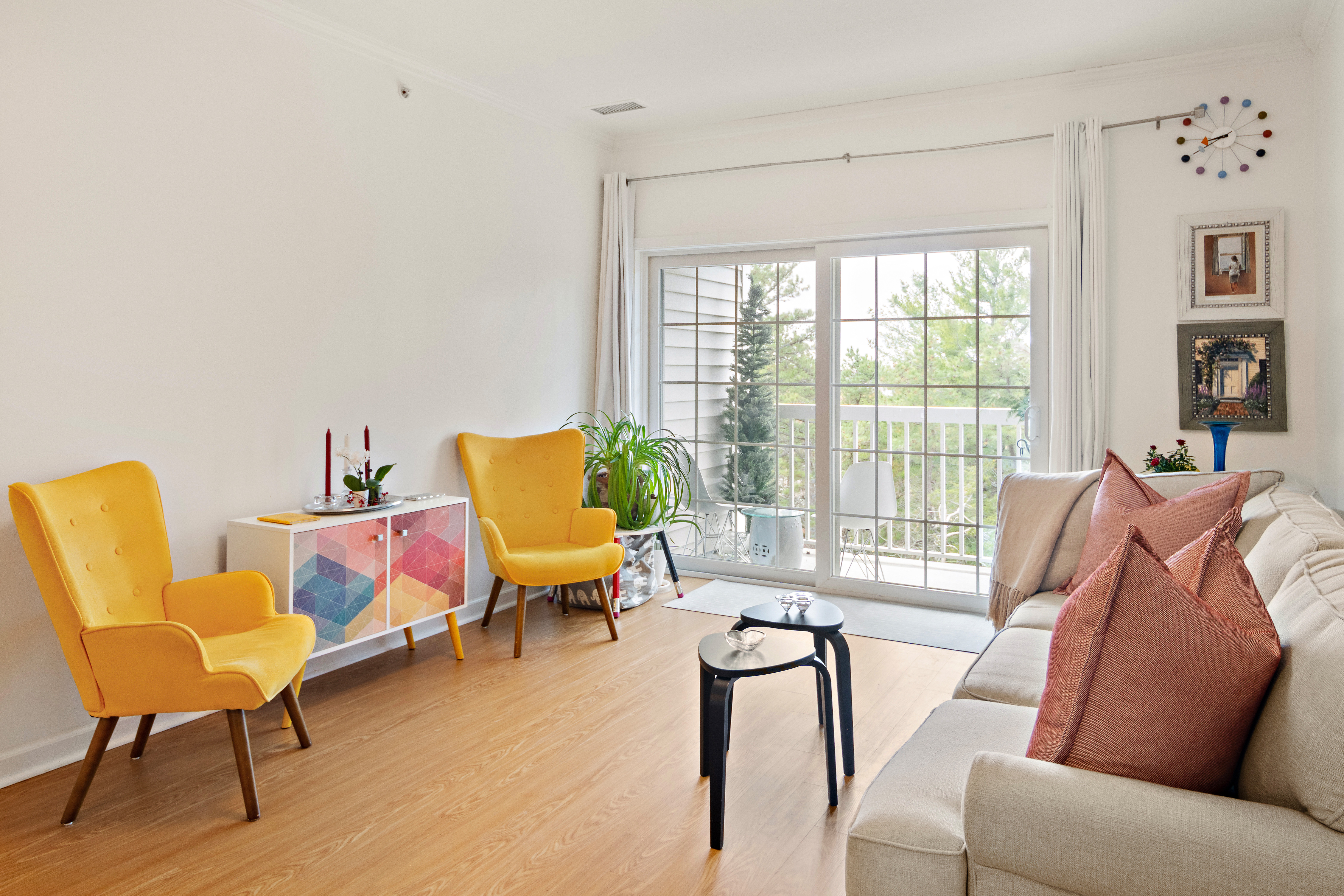 107 Clocktower Drive, Unit 407 Waltham, MA 02452 - Photo 4 of 19 a living room with furniture and a floor to ceiling window