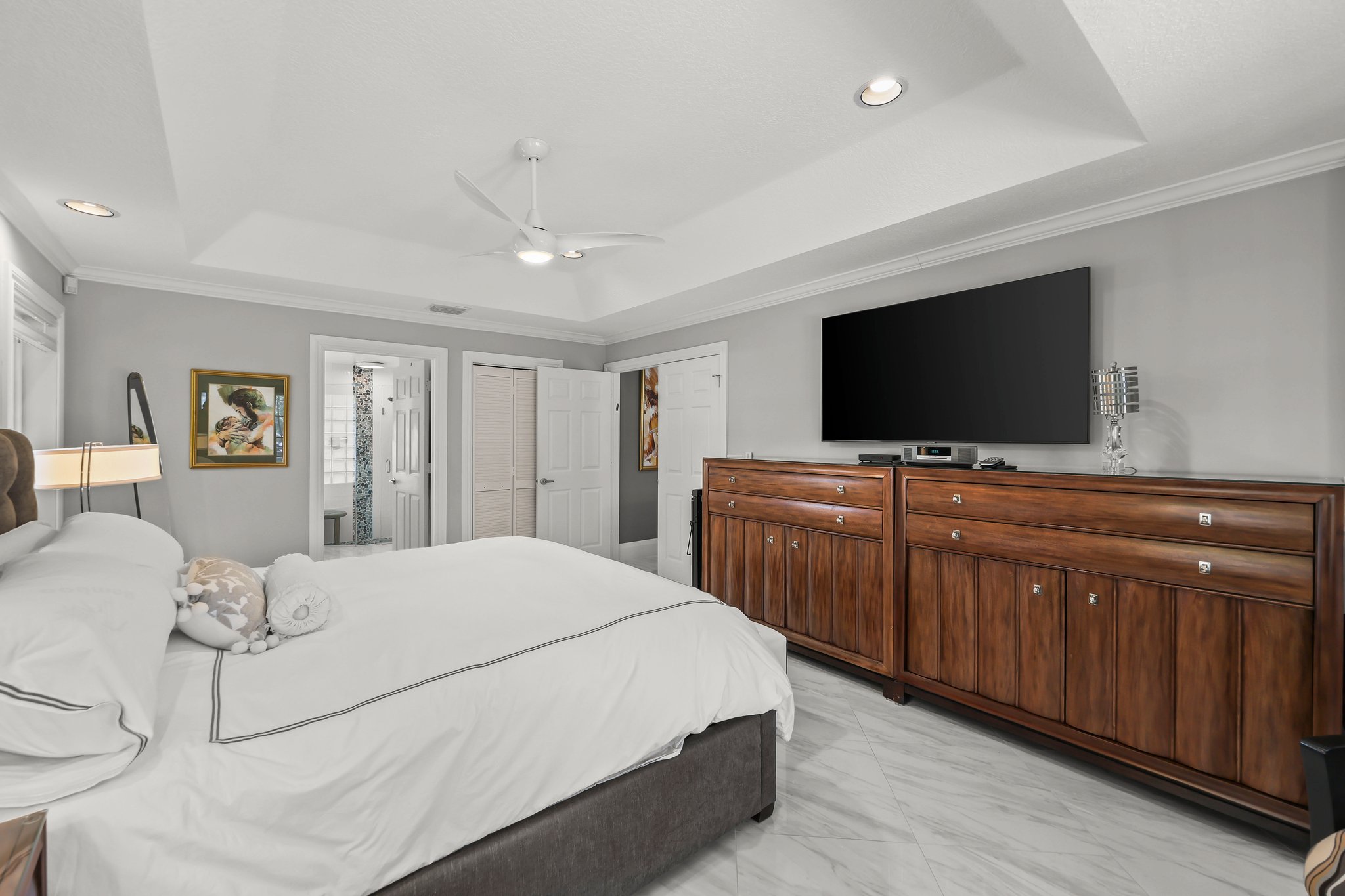 20317 Hacienda Court Boca Raton, FL 33498 - Photo 32 of 100 a bedroom with a bed and a flat screen tv