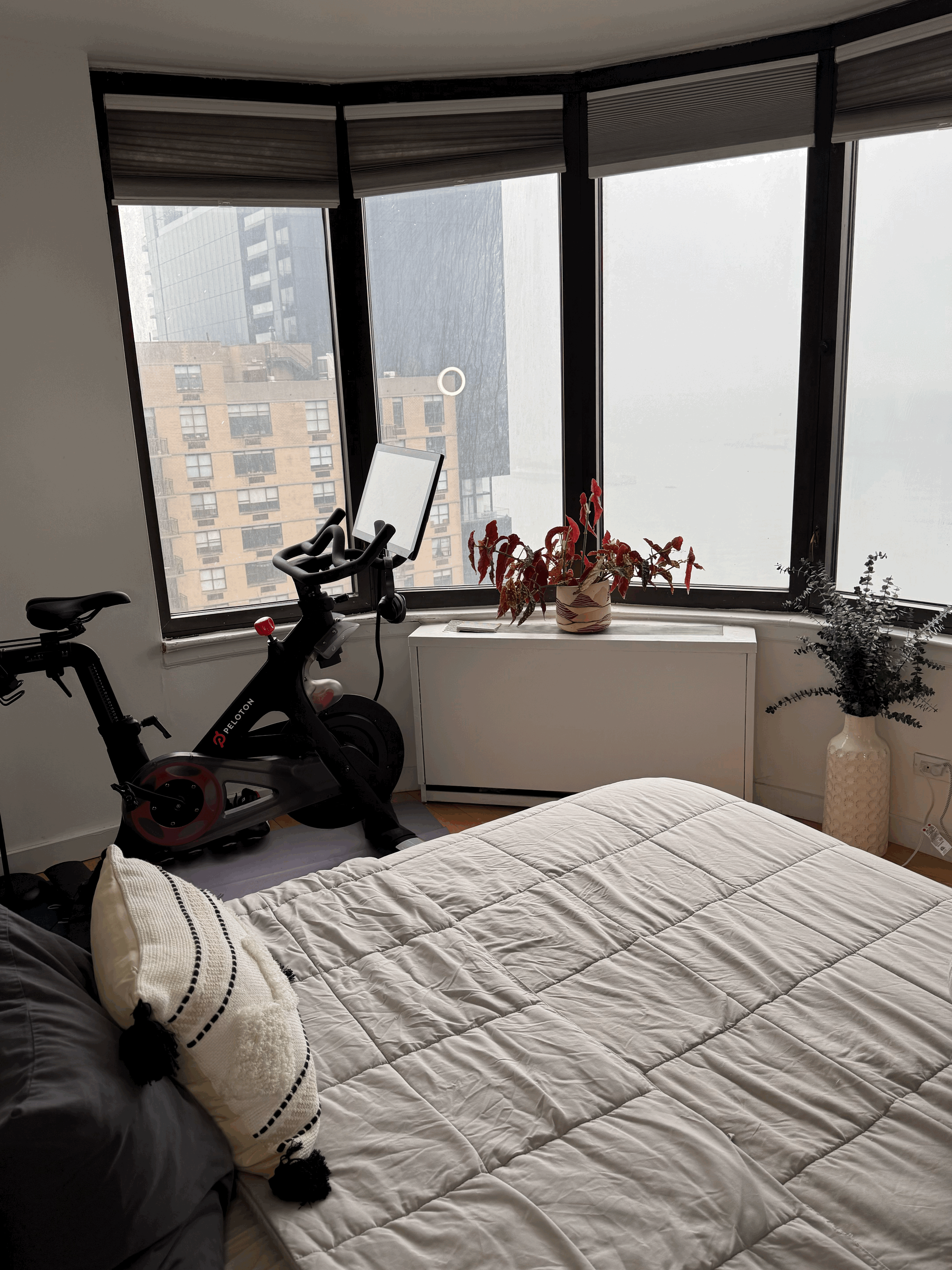 330 East 38th Street, Unit 38I Manhattan, NY 10016 - Photo 6 of 17 a bedroom with bed and glass window