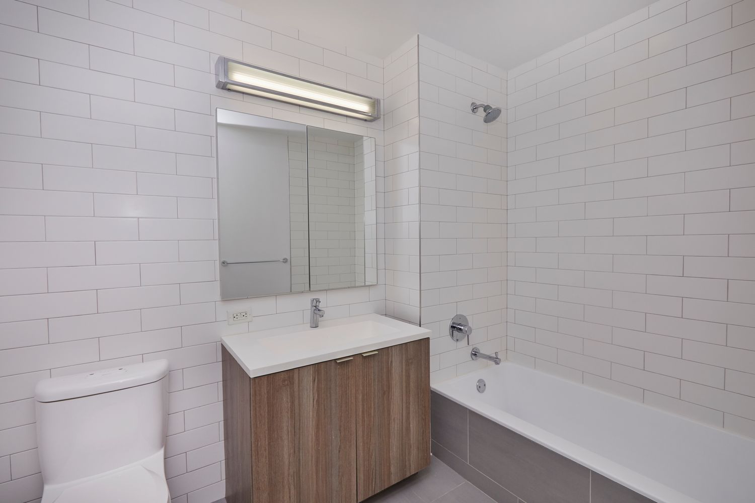23 West 116th Street, Unit 8A Manhattan, NY 10026 - Photo 16 of 28 a bathroom with a tub a sink and a shower
