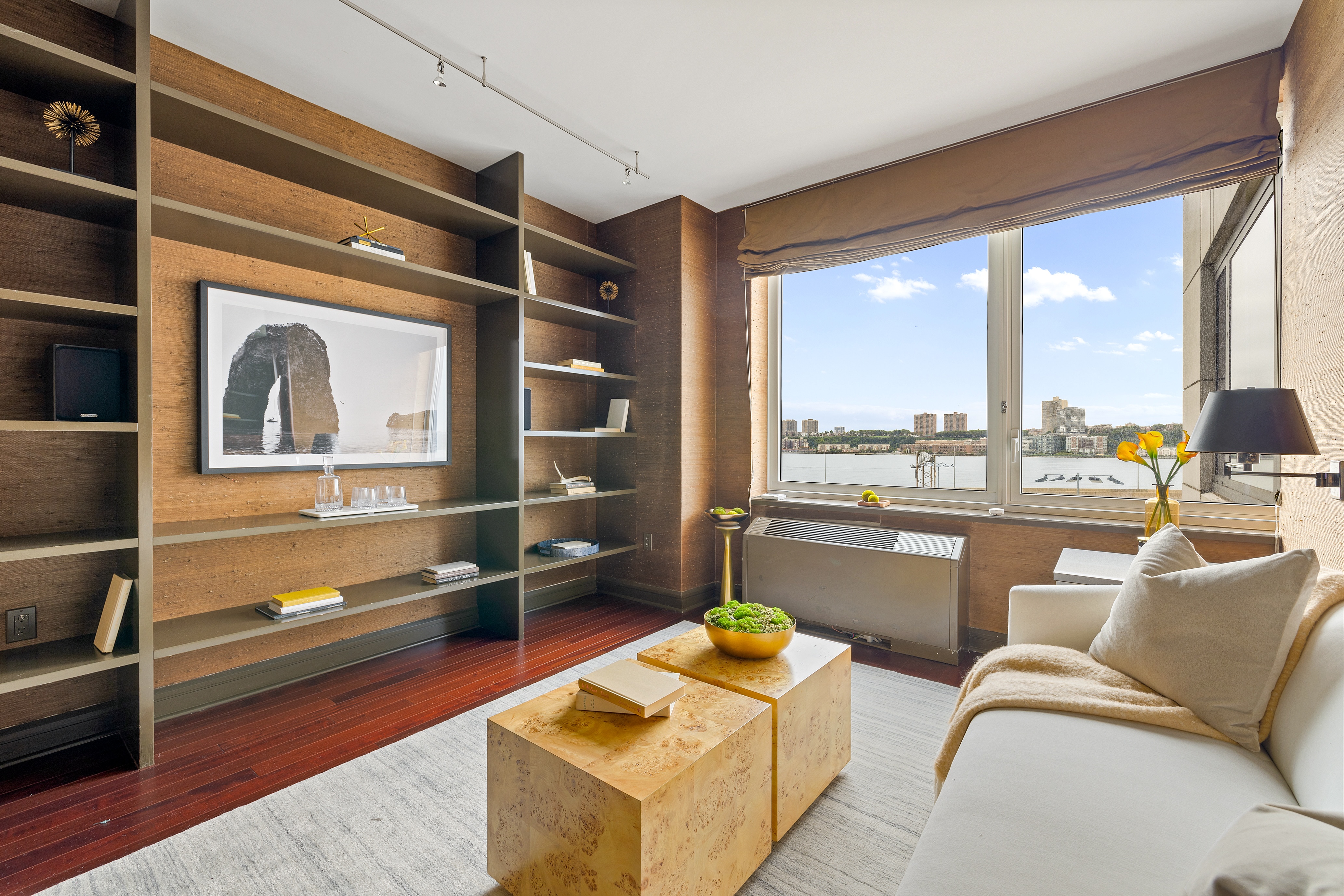 80 Riverside Boulevard, Unit 6B/L Manhattan, NY 10069 - Photo 7 of 17 a living room with furniture and a floor to ceiling window