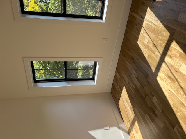 1393 Herkimer Street, Unit 2 Brooklyn, NY 11233 - Photo 3 of 9 a view of a bedroom with wooden floor and window