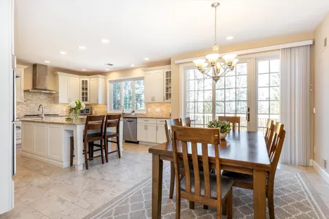 a view of a dining room with furniture window and outside view