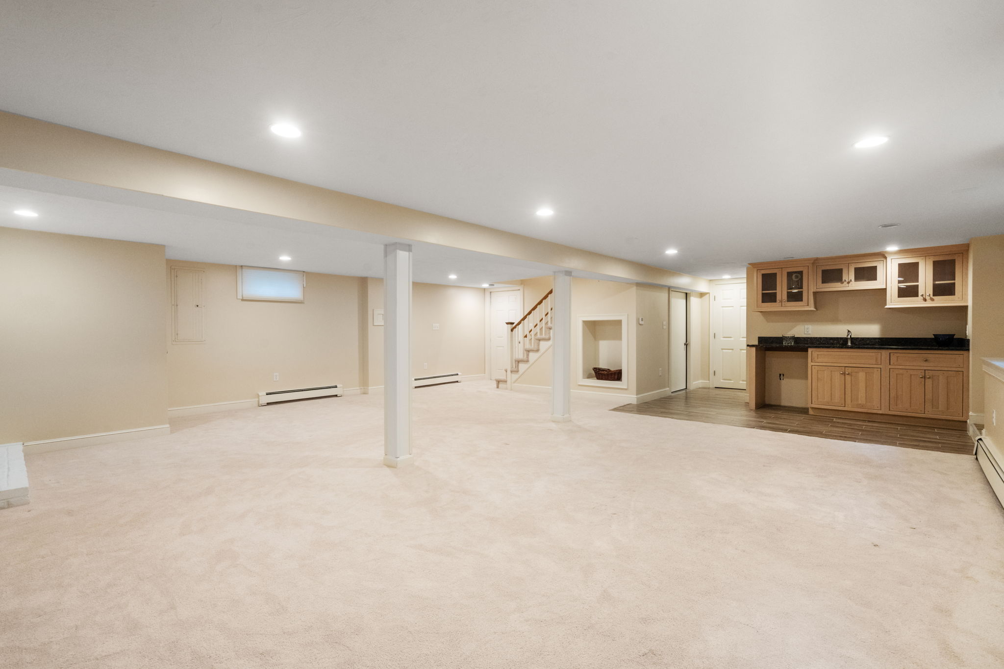 4 Gage Road Wayland, MA 01778 - Photo 21 of 32 a view of an empty room with a kitchen
