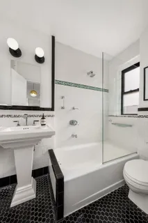 a bathroom with a sink a toilet and a bathtub