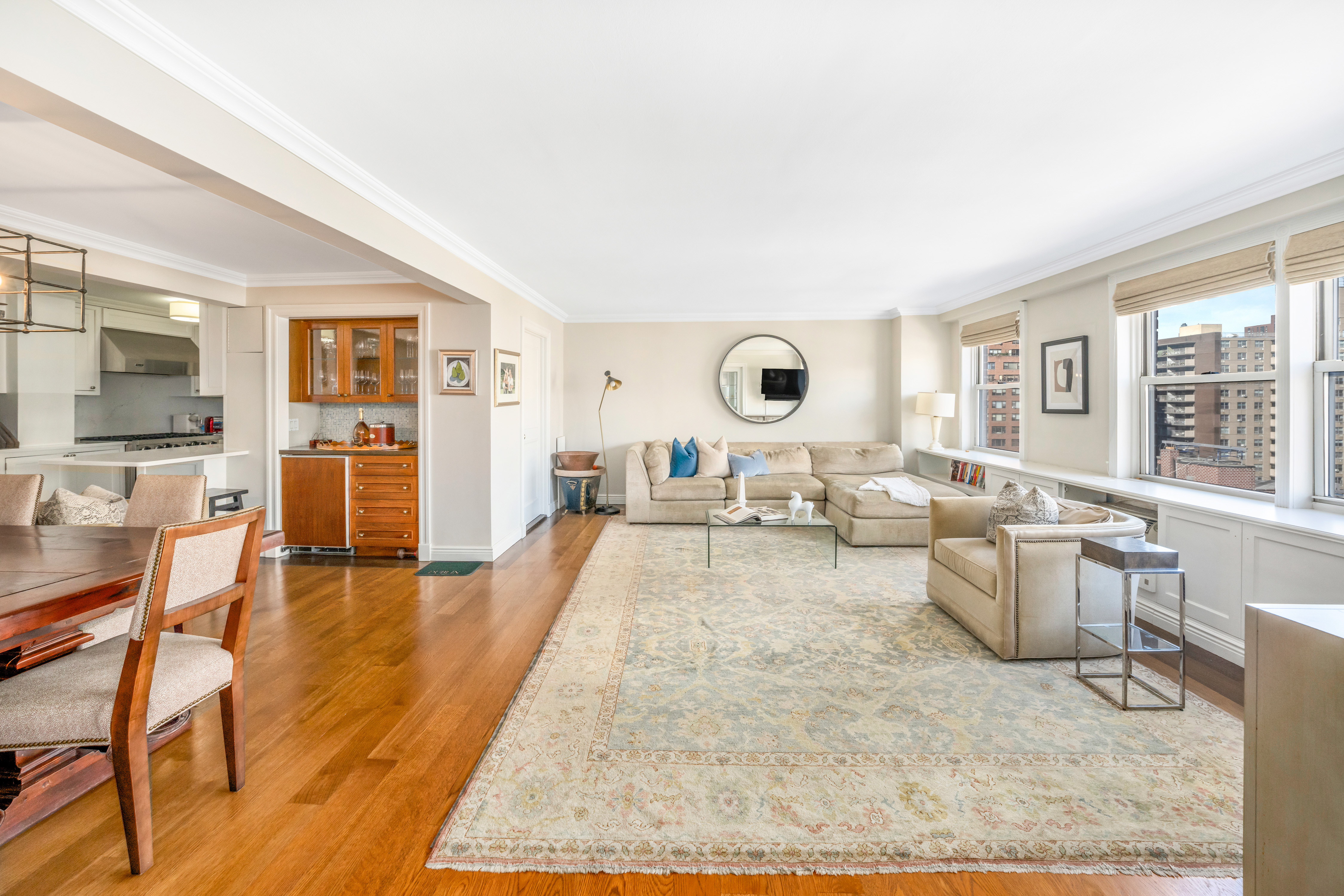 444 East 84th Street, Unit PHE Manhattan, NY 10028 - Photo 3 of 12 a living room with furniture and wooden floor